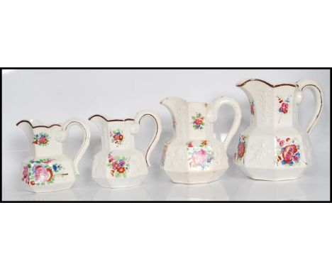 A group of four 19th Century Staffordshire ceramic jugs, possibly mason's in the Hydra shape of octagonal form having serpent