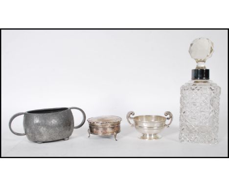 A selection of silver items to include a twin handled table salt of circular form raised on a plinth base (hallmarks present 