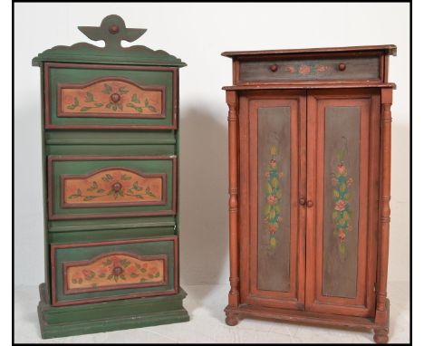 Two 20th Century Swiss style painted cabinet cupboards, the first a series of three panel drawers painted in green with centr