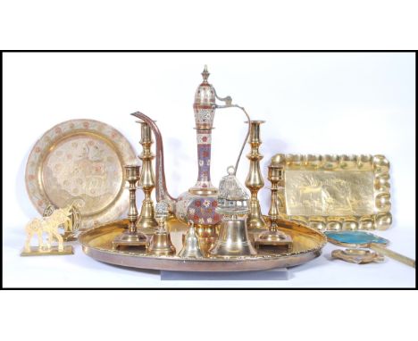 A collection of 20th Century brass items to include a Persian engraved teapot, an Indian engraved plate decorated with an ele