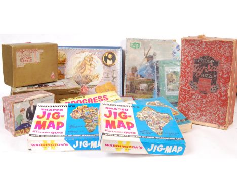 A collection of assorted vintage puzzles to include puzzles by; Victory, Waddingtons, The Academy and a puzzle of the Mary Ro