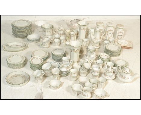 An extensive Johnson Bros dinner service and other wears in the Eternal Beau pattern to include plates, bowls, dishes, salt a