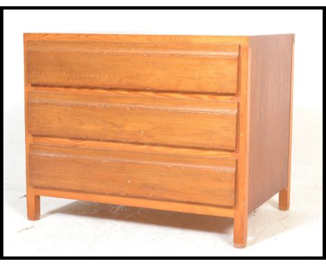 A 20th Century retro Danish light teak wood blind front chest of drawers, three straight drawers raised on square supports. D