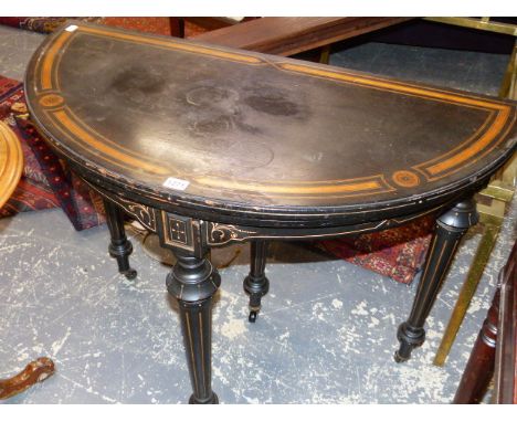 A 19th.C.SATINWOOD INLAID EBONY DEMI LUNE  GAMES TABLE, A SMALL DRAWER TO THE BACK FLANKING A CENTRAL LEG EXTENDING TO SUPPOR