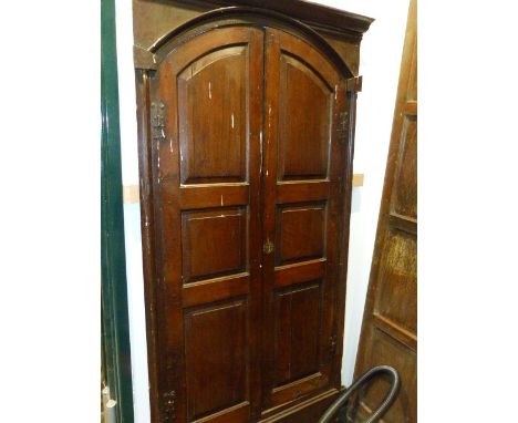 AN 18th.C.PAIR OF PANEL OAK ARCH TOP CABINET DOORS IN ORIGINAL FRAME.   104 x 195cms.