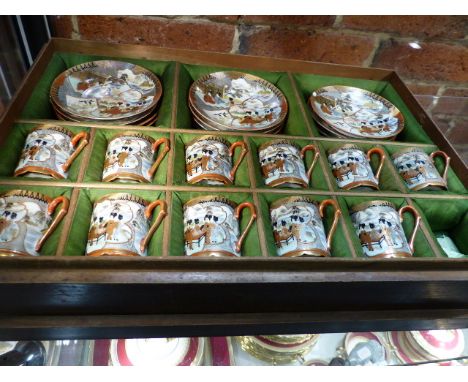 A WOODEN CASED PART SET OF KUTANI EGSHELL COFFEE CANS AND SAUCERS.