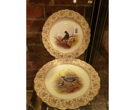 A PAIR OF ROYAL WORCESTER PLATES, DATE CODES FOR 1901, THE INTERIORS PAINTED WITH BLACK GAME AND WATERBIRDS WITHIN BROWN PRIN