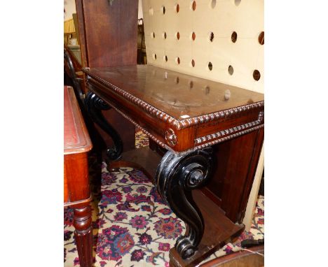 A 19th.C.AND LATER ROSEWOOD CONSOLE TABLE ON EBONISED SCROLL SUPPORTS AND PLATFORM BASE.   112 x 54 x H.88cms.