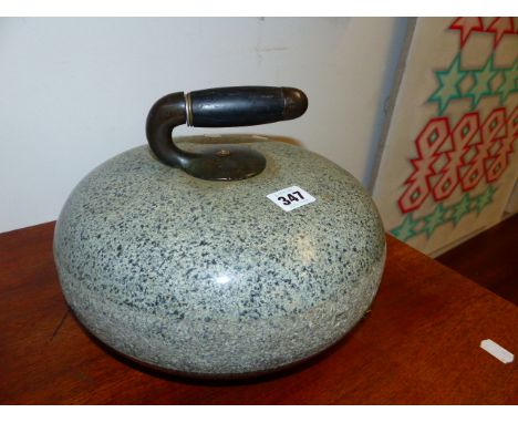 A VINTAGE GRANITE CURLING STONE.