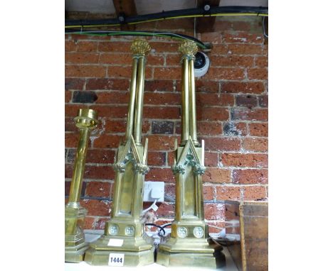 A PAIR OF NEOGOTHIC REVIVAL BRASS CLUSTER COLUMN LAMP BASES, EACH WITH TRIANGULAR ARCHED NICHES ABOVE THE SQUARE CANTED FEET,