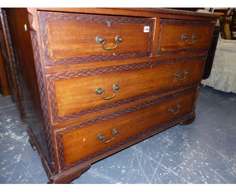 AN EDWARDIAN&nbsp; MAHOGANY LINEN PRESS, THE BLIND FEET CORNICE OVER DOORS ENCLOSING SLIDES ABOVE TWO SHORT AND TWO LONG DRAW