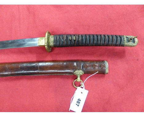 A JAPANESE OFFICER'S SWORD WITH A 67cms LONG BLADE, FULL REGULATION MILITARY MOUNTS AND CONTAINED IN SERVICE LEATHER COVERED 