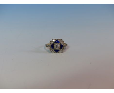 AN ANTIQUE OLD CUT DIAMOND AND ENAMEL RING, THE CENTRAL DIAMOND IS SURROUND BY FOUR TRIANGULAR PANELS OF BLUE ENAMEL AND FURT