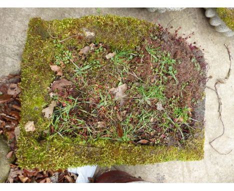 AN ANTIQUE BOW FRONT STONE TROUGH.   W.71cms.