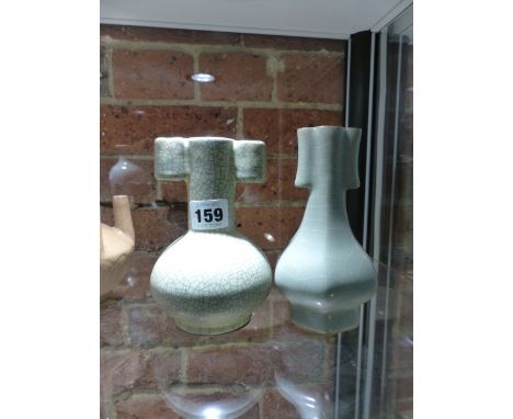 TWO CHINESE GUAN TYPE ARROW VASES, ONE WITH BLACK CRACKLED GREEN GLAZE.  H.14.5cms   THE OTHER WITH WHITE CRACKLED CELADON GL