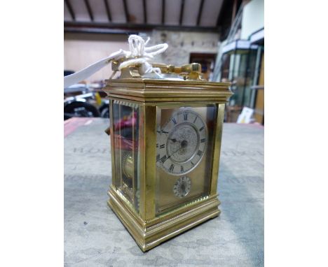 A FRENCH GORGE CASED ALARM CARRIAGE CLOCK, THE REPEAT BUTTON ABOVE CIRCULAR SILVERED DIALS, THE STRIKE AND ALARM ON A BELL.  