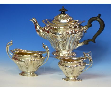 A BATCHELOR'S SILVER THREE PIECE TEASET BY B B, B'HAM 1900 AND 1901, THE FLUTED BODIES WORKED WITH ROCOCO VIGNETTES.  (INCLUD