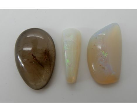 Two freeform cut pieces of white opal approx dimensions larger; 3cm x 1.7cm x 0.5cm, smaller 2.6cm x 0.9cm x 1cm, weight 5.8g