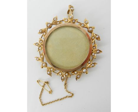 A 15ct gold pearl set locket pendant brooch, diameter 4.5cm, weight 13.4gms Condition Report: Glass at the reverse missing, a