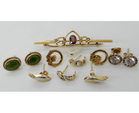 A 9ct gold garnet and pearl brooch, a pair of 9ct Irish Claddagh earrings, and a collection of other earrings in gold and yel