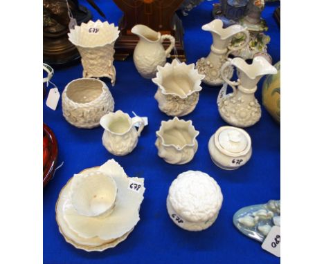 A collection of fourteen pieces of Belleek to include two 'Aberdeen' design jugs, 15cm high, cachepot, 9cm high, leaf shaped 