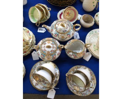 A Noritake teaset decorated with roses, comprising teapot, milk jug, sucrier, four cups and saucers together with five Parago