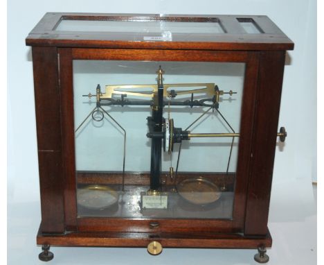 A set of Baird &amp; Tatlock scales in glazed case Condition Report: Available upon request