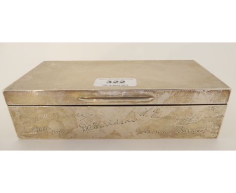 A silver cigarette box, with engine turned decorated lid, the front inscribed with five assorted signatures, London 1934, 19.