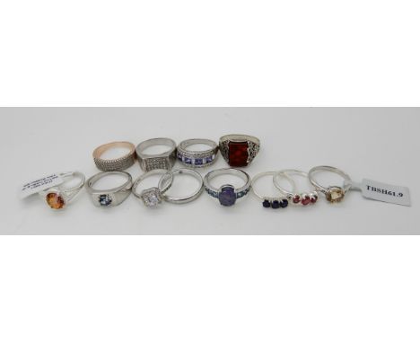 A collection of silver gem set rings to include opal triplets, mystic topaz, ruby etc some new with tags Condition Report: No