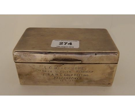 A silver cigarette box, Birmingham 1922, of rectangular form, the lid with engine turned decoration inscribed on the front "L