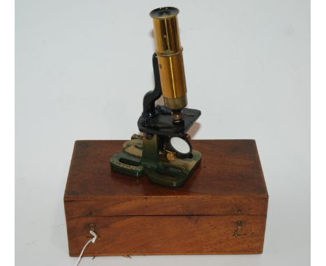 A cased student microscope stamped R &amp; J Beck, 20cm high Condition Report: Available upon request