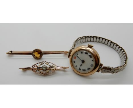 A 9ct gold ladies vintage watch head, with gold plated expanding strap, a 9ct gold citrine bar brooch and a yellow metal aqua