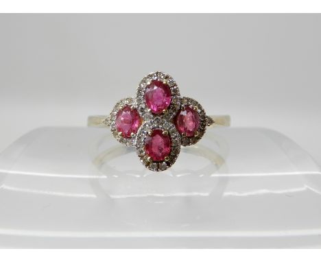 A 9ct gold ruby and diamond cluster ring, size T1/2, weight 2.5gms Condition Report: Available upon request
