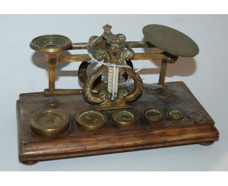 Two sets of vintage brass postal scales, one by Samson Mordan &amp; Co, London with associated weights, 22cm wide Condition R
