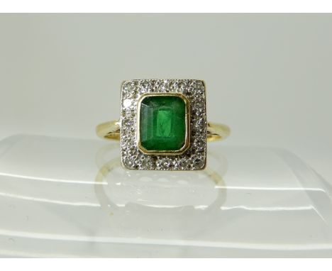 An 18ct yellow and white gold, emerald and diamond ring, size L1/2, weight 3.8gms, with insurance valuation for £685 Conditio