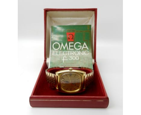 A gold plated retro Omega electronic F300 Geneve Chronometer circa 1976 strap approx 19cm case approx 4.3cm x 3.7cm with orig