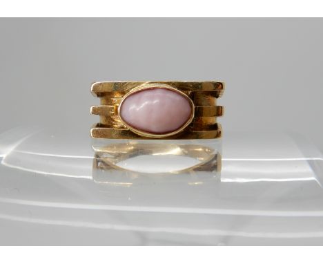A 14k gold retro ring set with a queen conch pink pearl, size J1/2, weight 4.4gms Condition Report: Conch pearl slightly abra