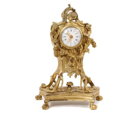 19th century French gilt cartel clock with circular white enamel dial in ormolu case with rococo floral scroll decoration on 