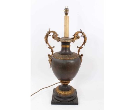 Early 20th century parcel gilt and brass two handled vase table lamp, of classical form applied with mixed metal and enamel f