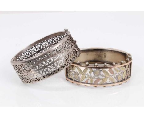 Victorian silver hinged bangle with pierced foliate decoration, two colour gold overlay and ball borders (Birmingham 1883) to