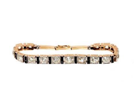 Art Deco diamond bracelet with a line of 15 graduated old cut diamonds, grain set in a box shape millegrain setting interspac