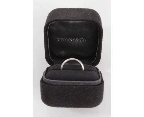 Tiffany &amp; Co. platinum wedding ring, size K¾, hallmarked London 2000, in Tiffany &amp; Co. box.