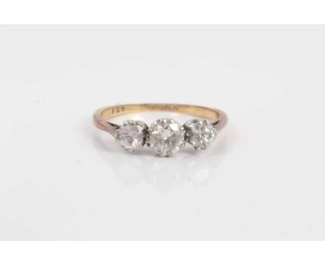 18ct gold diamond three stone ring with three brilliant cut diamonds, estimated to weigh approximately 0.70cts total, in plat