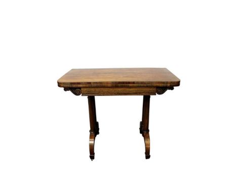 George IV rosewood card table, the rounded rectangular fold over top with baize lined playing surface and well below, raised 