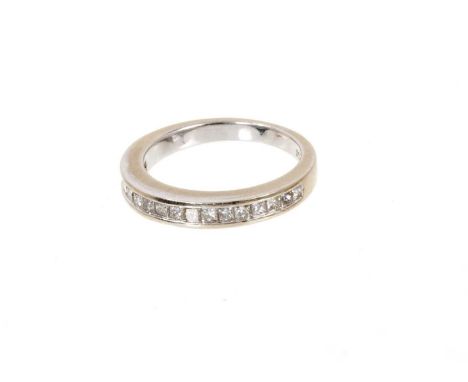 Diamond eternity ring with a half hoop of princess cut diamonds in 14ct white gold channel settingWeight 3.6 grams. Ring size