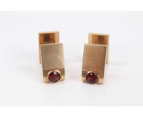 Pair of 1950s Art Deco style gold and garnet cufflinks with engine turned decoration and Patent mechanism, hallmarked London 