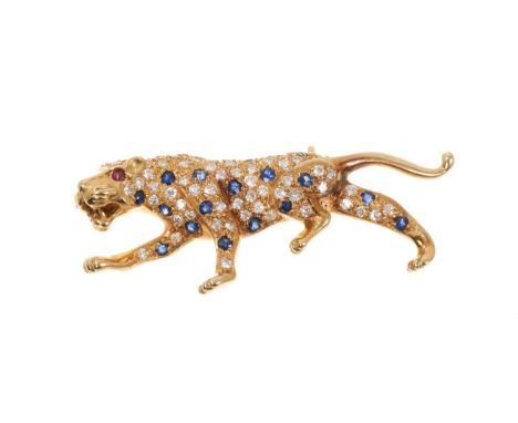 18ct gold diamond and sapphire Panther brooch with ruby eyes and pavé set diamonds and blue sapphires to the body, hallmarked