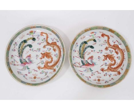 A pair of Chinese polychrome painted porcelain dishes, decorated with a dragon and phoenix pattern, Guangxu marks, 19th/20th 