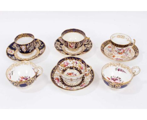 Early 19th century Coalport tea wares, with polychrome floral decoration on gilt patterned grounds, some pieces moulding, inc