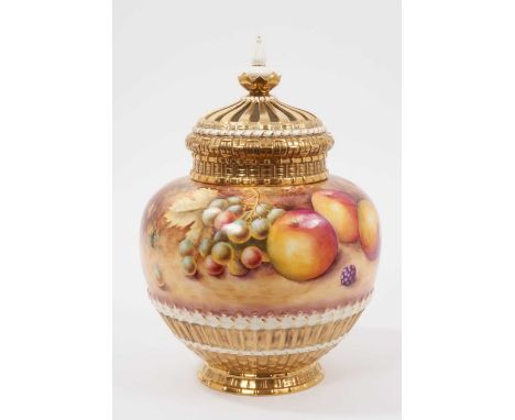 A Royal Worcester pot pourri vase with pierced cover, hand painted with fruit and signed by Terry Nutt, 26cm highIn good cond